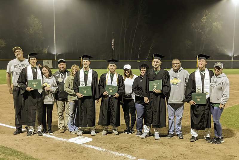 Members of the baseball team celebrate graduation even away at the NCAA tournament