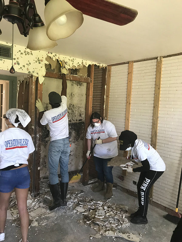 Students help clean up after Hurricane Harvey