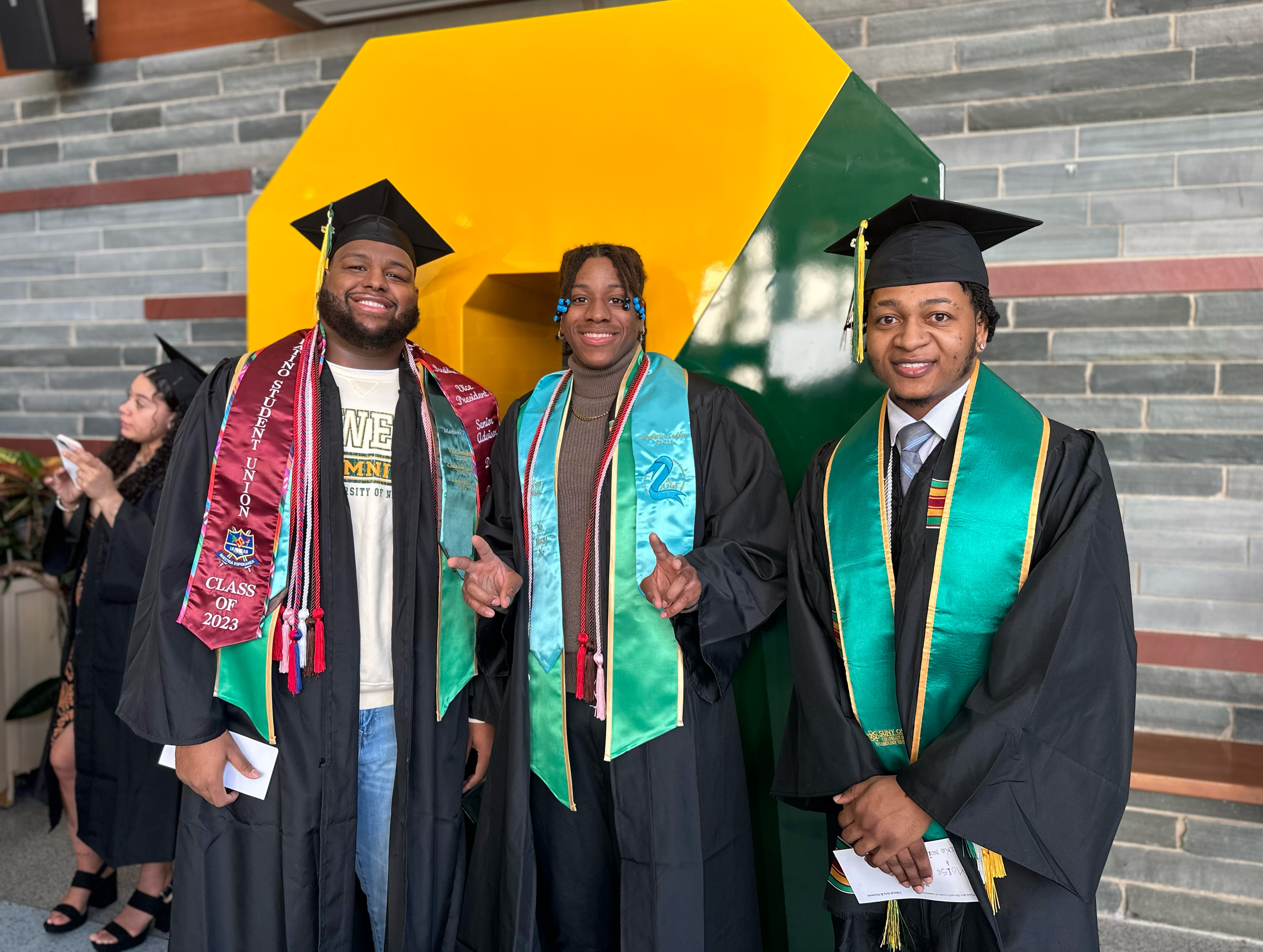 Students gather in the Marano Campus Center food and activity court before walking the stage at December Commencement.