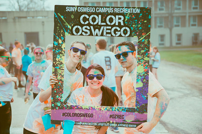 Students wearing colorful dye after Color Oswego Run