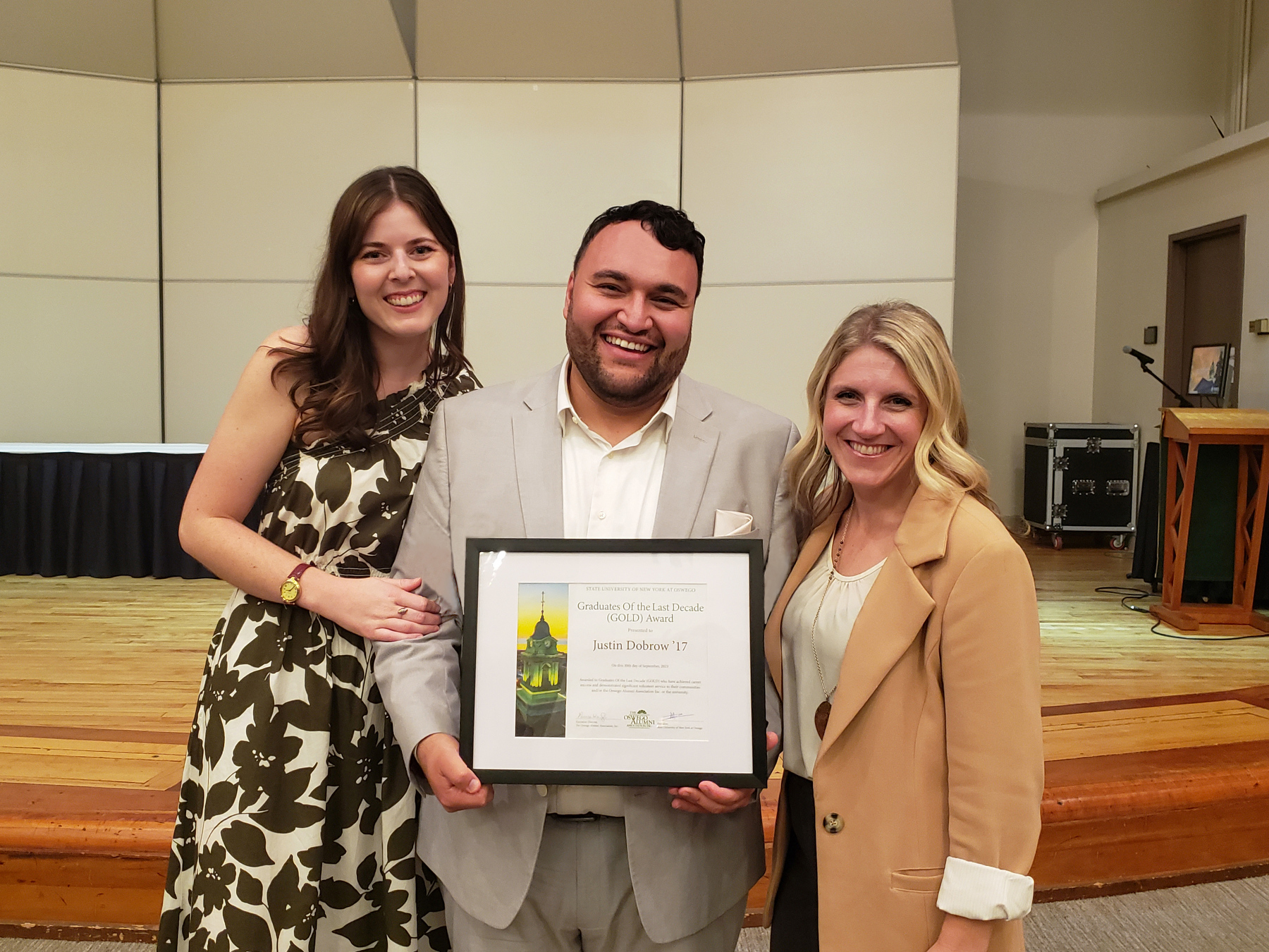 Justin Dobrow '17 (center), senior manager of partner operations for Peacock at NBCUniversal, received the Graduates of the Last Decade (GOLD) award at the Communication Studies Alumni Dinner on Sept. 30. He is joined in this photo by his wife Kalie Dobrow ‘16 (left) – now senior supervisor, social strategy at Edelman – and Laura Kelly ‘09, director of alumni and parent relations.