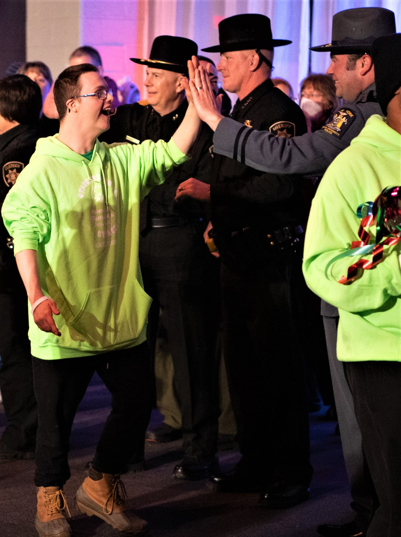 University Police Chief Scott Swayze high-fives a participant at the New York Special Olympics Opening Ceremonies with more than 500 athletes on Feb. 24 in Syracuse. 