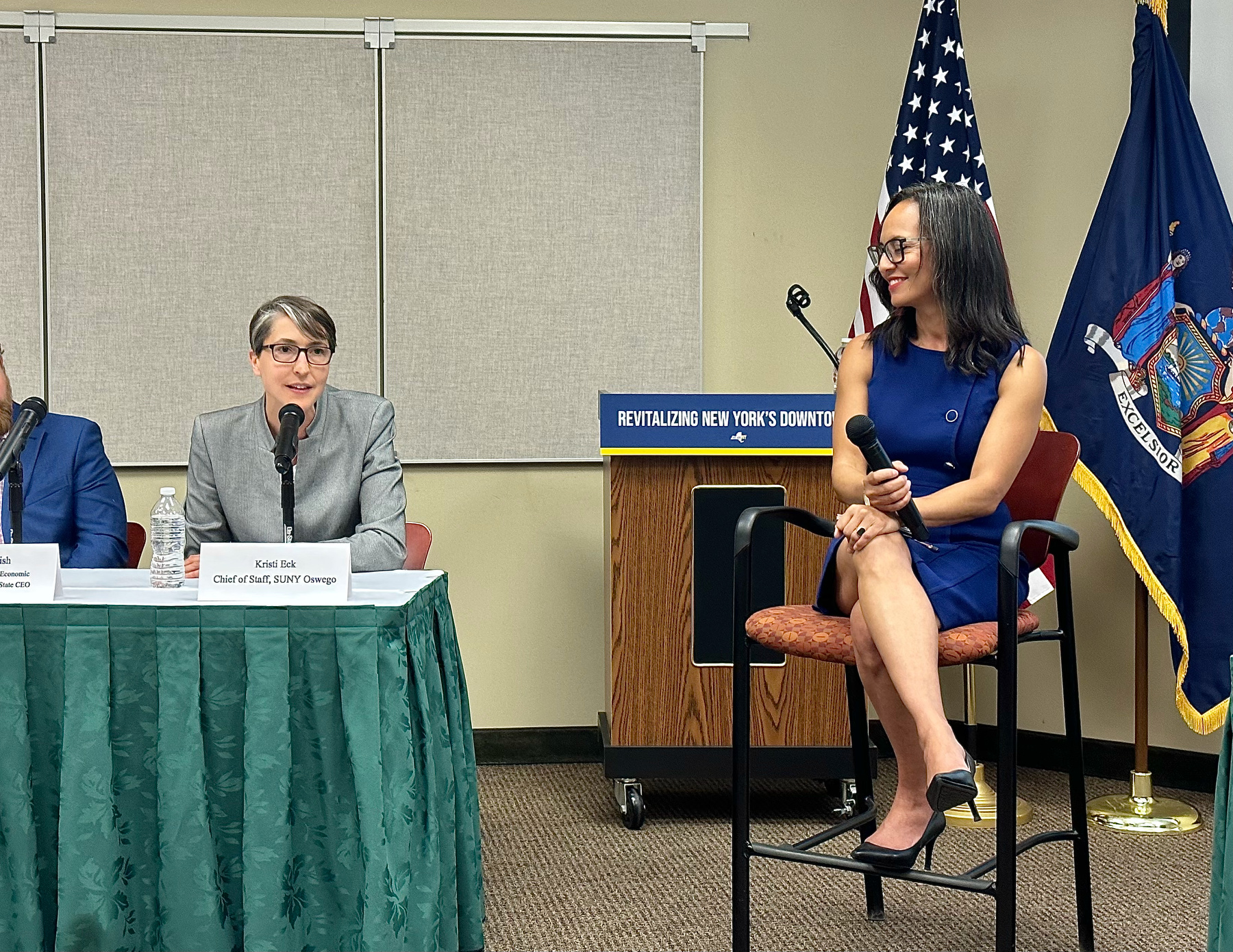 During a event at SUNY Oswego’s Syracuse Campus on July 26, Chief of Staff/Executive Director of Strategic Initiatives, External Partnerships and Legislative Affairs Kristi Eck served on a panel of partners to the Downtown Revitalization Initiative (DRI) and NY Forward programs, moderated by (at right) Deputy Secretary of State for Planning, Development and Community Infrastructure Kisha Santiago