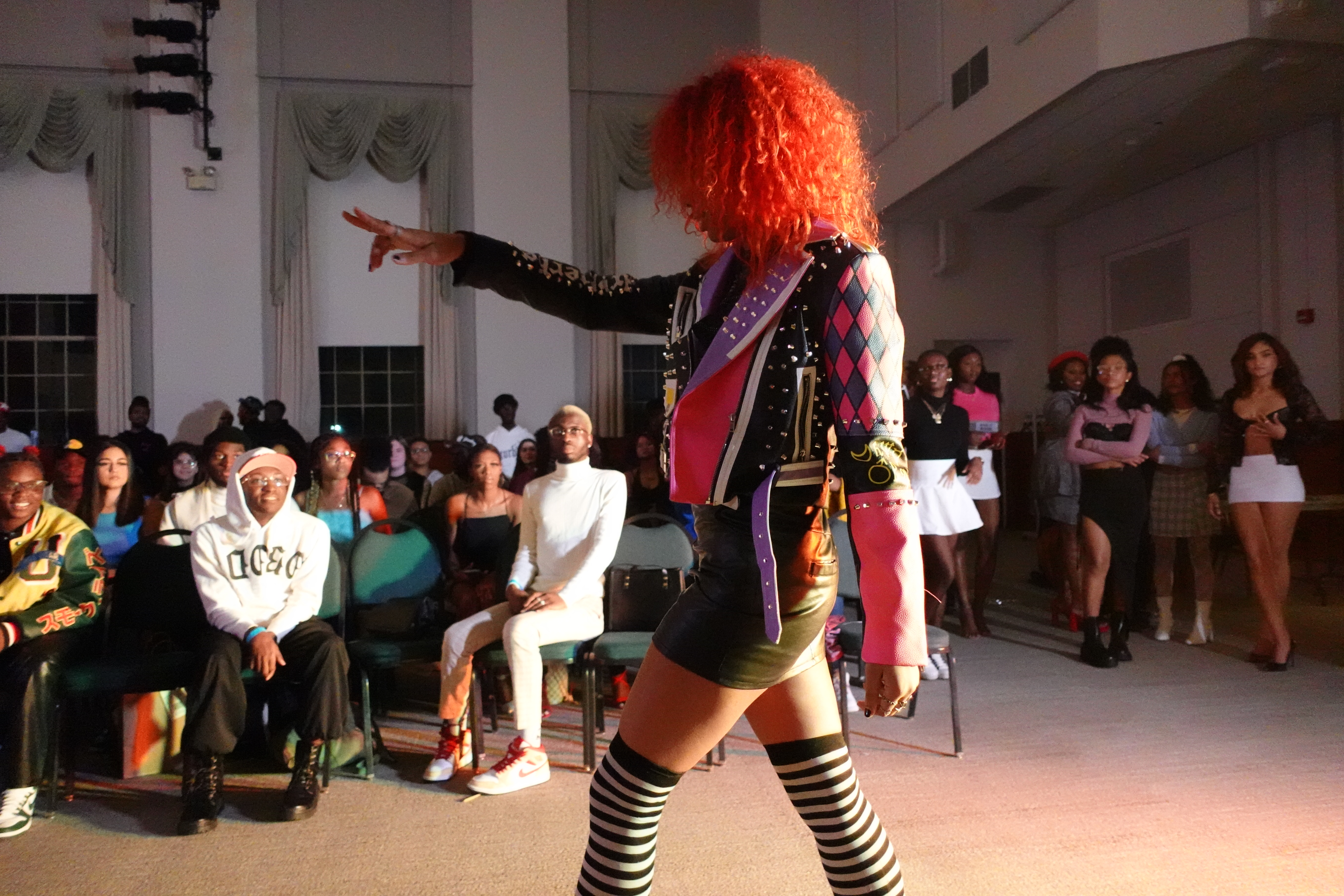 Juli-Anne Wood, the student secretary for Fashion At Oswego (FAO), walks the runway during FAO’s Homecoming: On the Runway” fashion show on Nov. 5 in Sheldon Hall ballroom. (Photo by Kashaun Blackman)