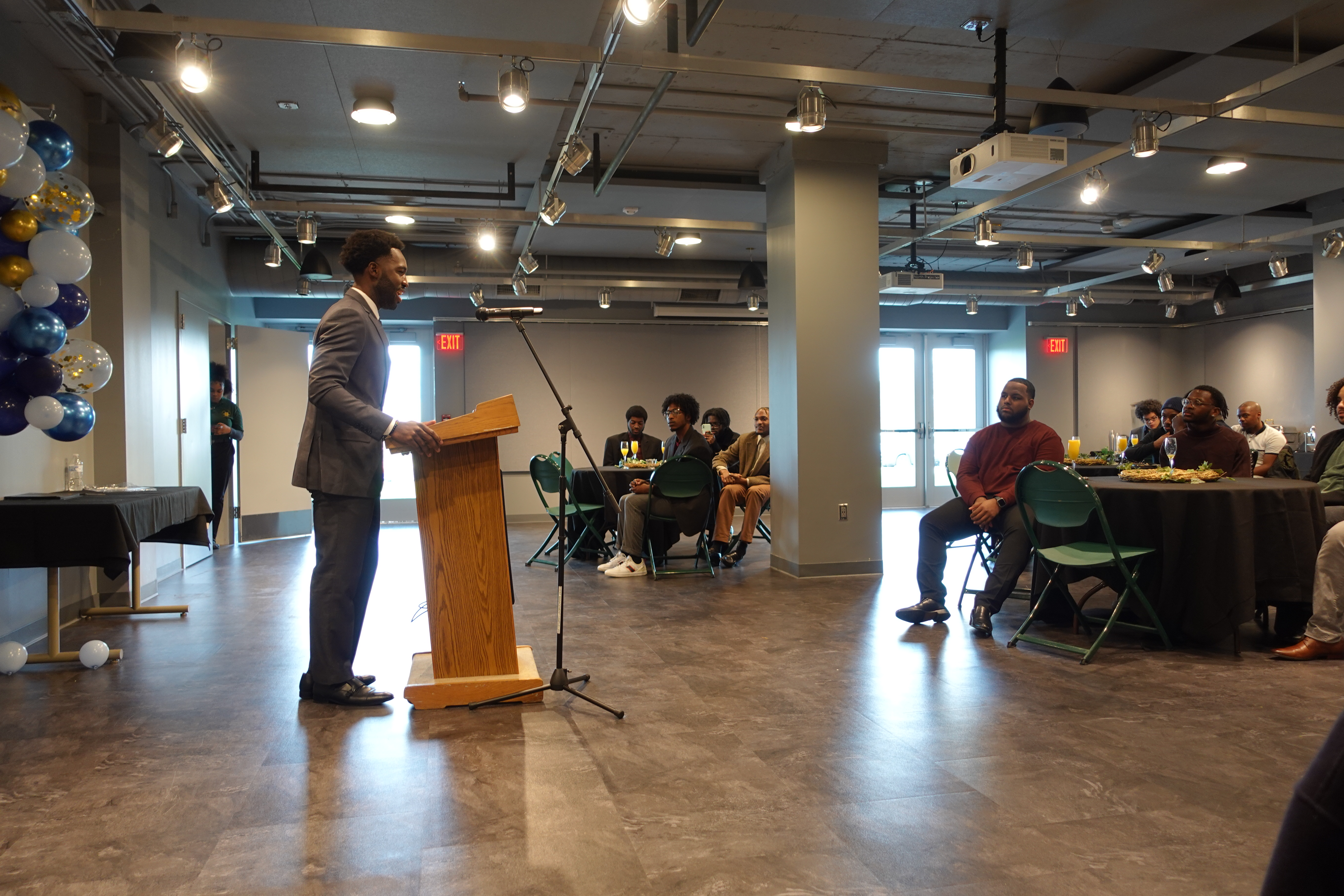 African-American Males’ Empowerment Network (AAMEN) founder and 2018 SUNY Oswego graduate Dr. Emannuel Agyapong gives the keynote speech at the AAMEN Black Excellence Networking Ball on Nov. 12 in The Space. (Photo by Kashaun Blackman)