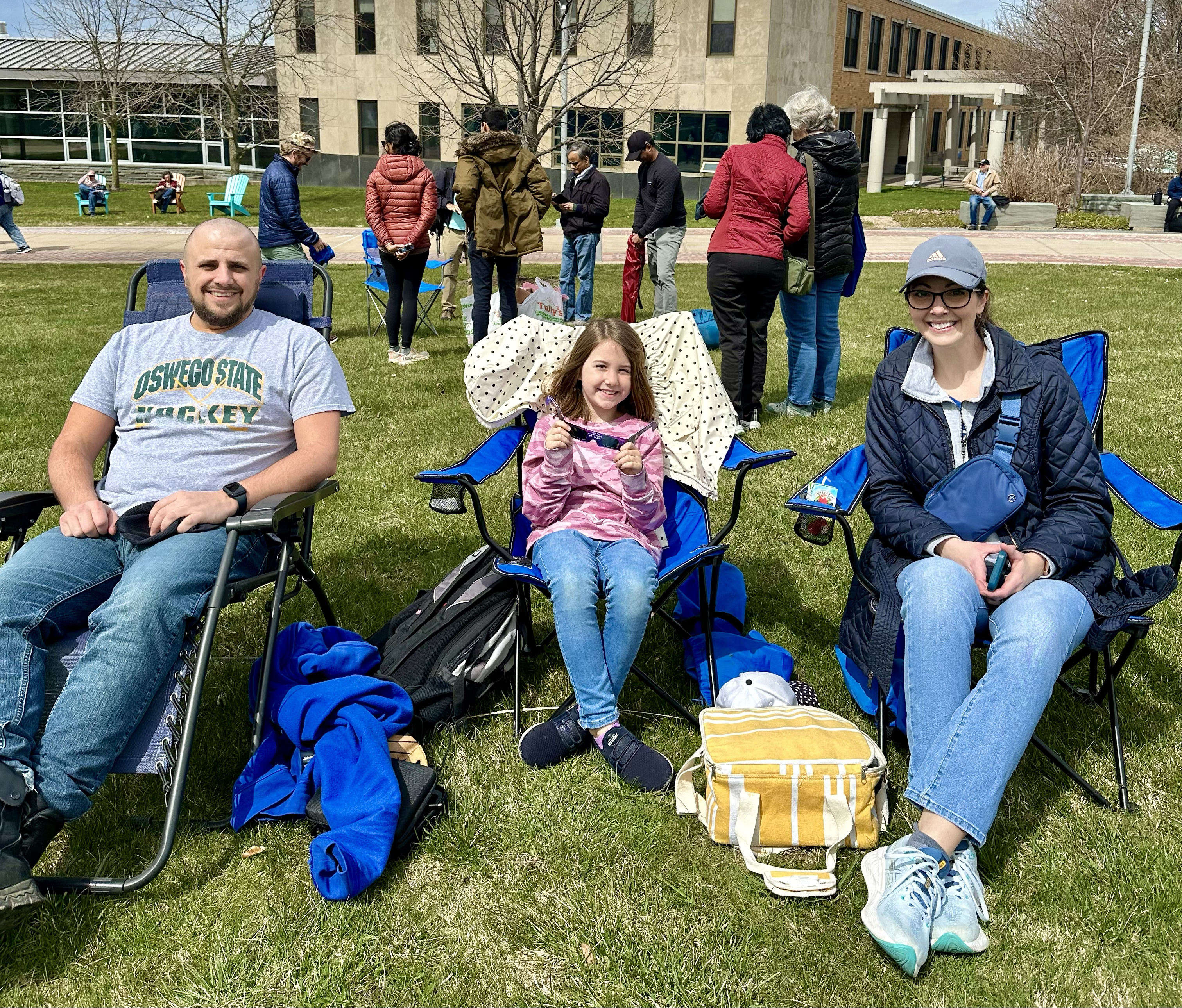 Eric Nemier, a 2012 SUNY Oswego alumnus, and his family returned to campus for the eclipse.