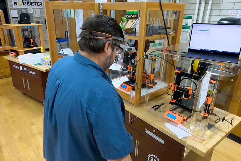 Dan Tryon of the technology education faculty works on protective face shields in his Park Hall lab