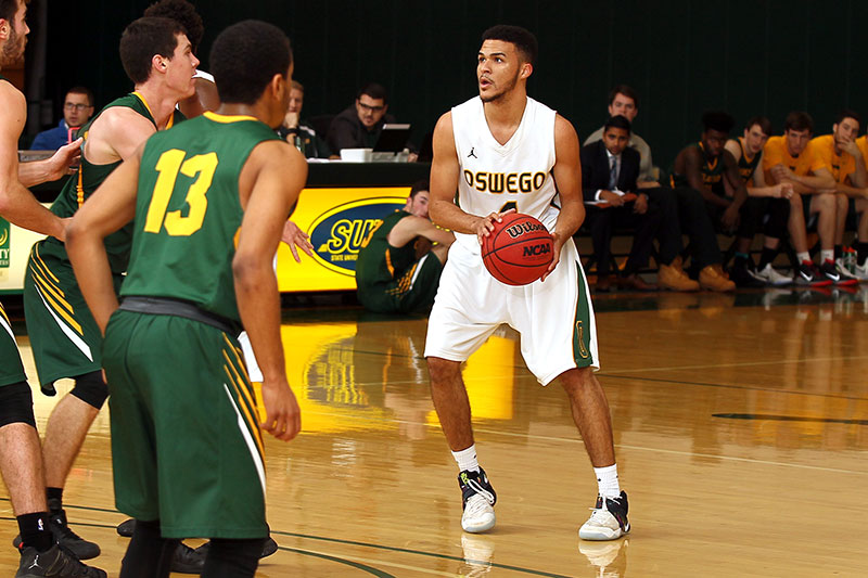 Jamir Ferebee sizes up a shot at a men's basketball game