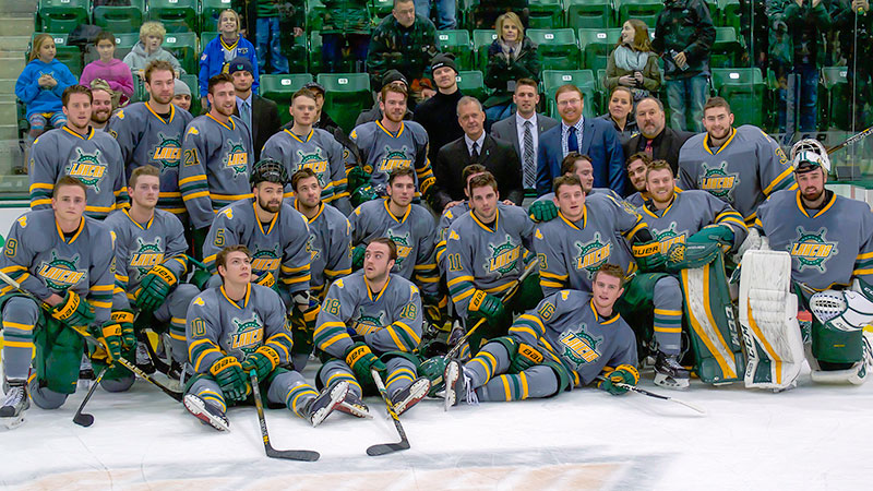 Ed Gosek, surrounded by team, recognized for 300th hockey coaching win