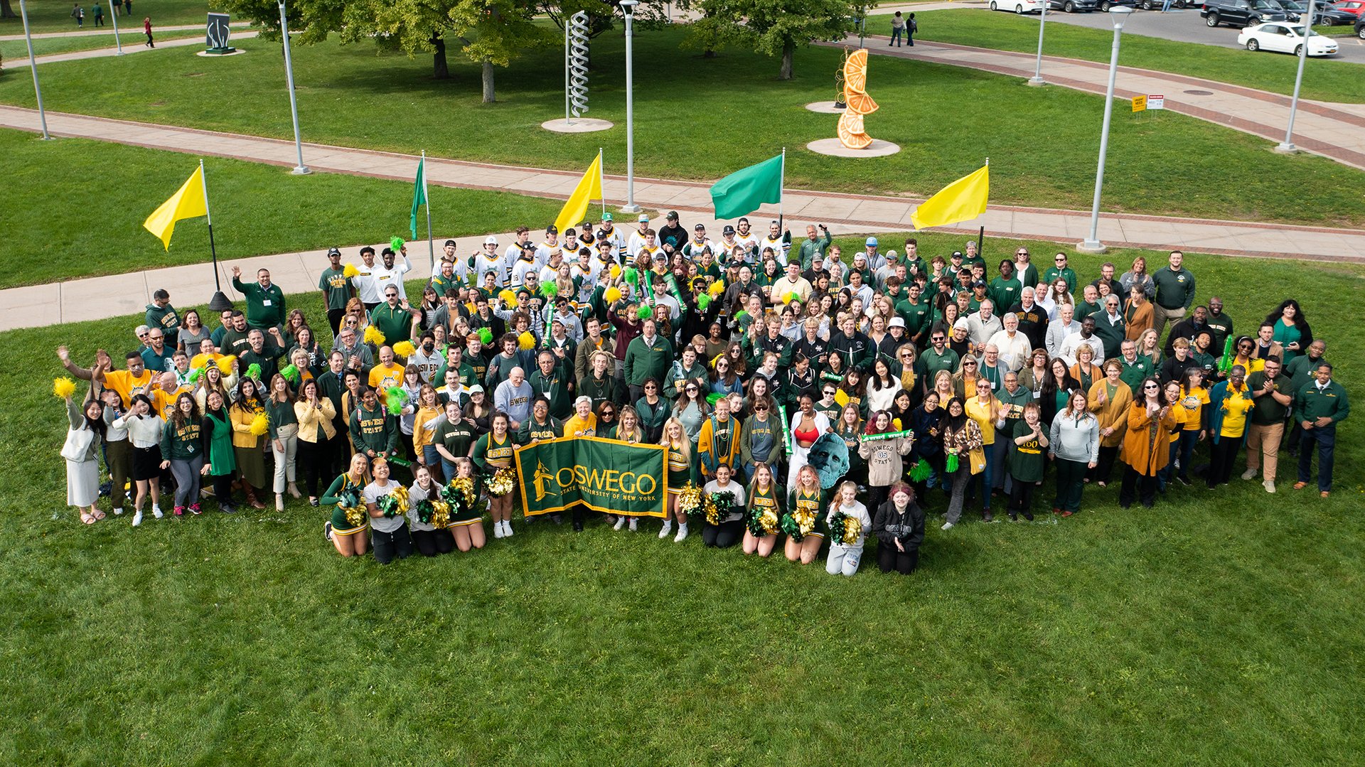 Students, alumni, faculty and staff showed their Oswego spirit by proudly showing Oswego's college colors in the official Green and Gold campus photo Sept. 30. The annual event is held in conjunction with Founder's Weekend.
