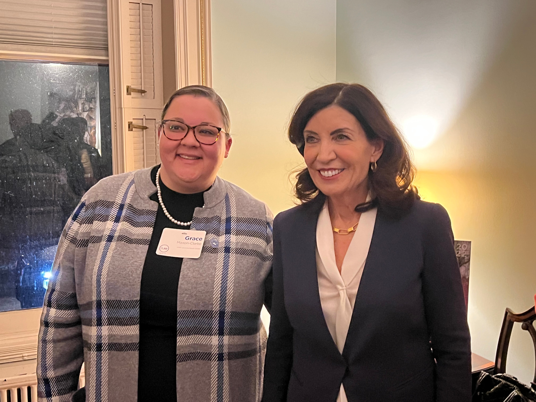 At the March 27 Women’s History Month in Albany, Grace Maxon-Clarke, an academic program counselor in Oswego’s Educational Opportunity Program Office, meets with New York State Gov. Kathy Hochul.