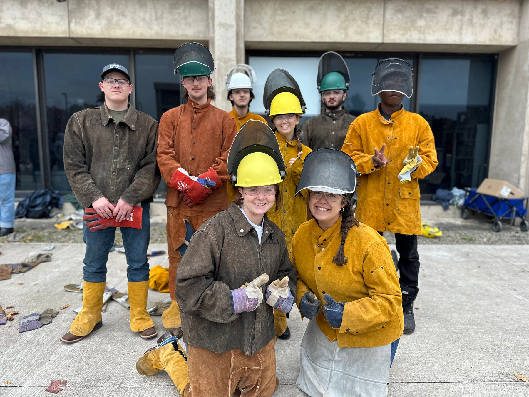 Students involved in this year’s Iron Pour on Oct. 20 pose for a group photo outside Tyler Hall. 