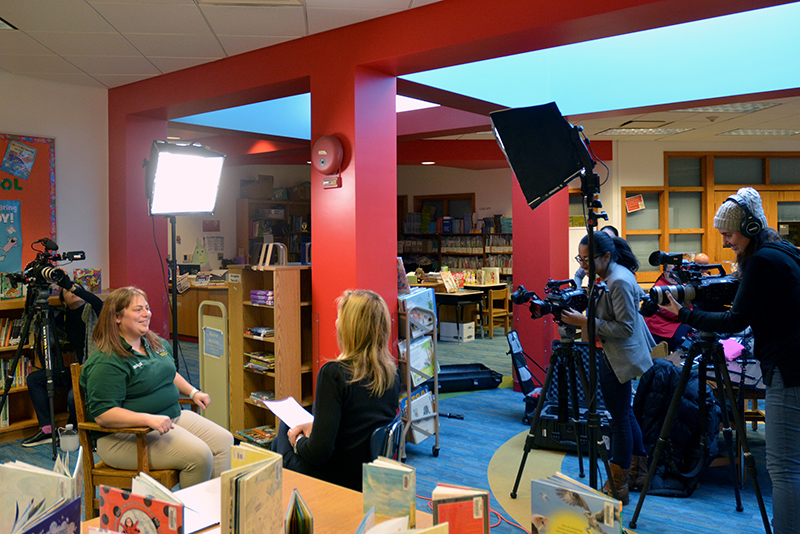 Criminal justice faculty member Jaclyn Schildkraut (seated, right) prepares for an interview with CNN anchor Brooke Baldwin