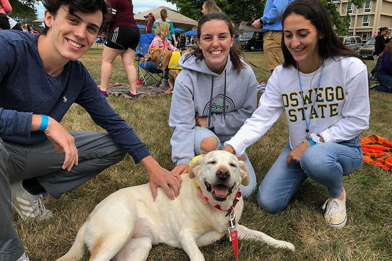 River the dog making students happy, because she's a good dog