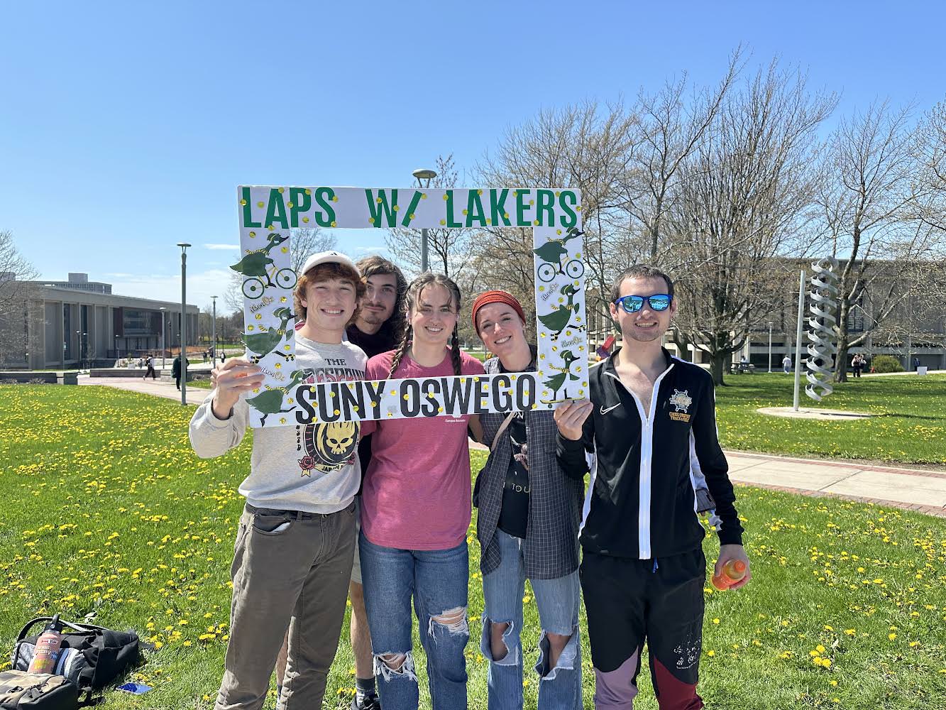 Members of Oswego’s Division III track and field team participate in Laps with Lakers. Pictured from left are Henry Rose, Matt Pietzak, Brenna O’Brien, Faith Coyle and Andrew Deming.