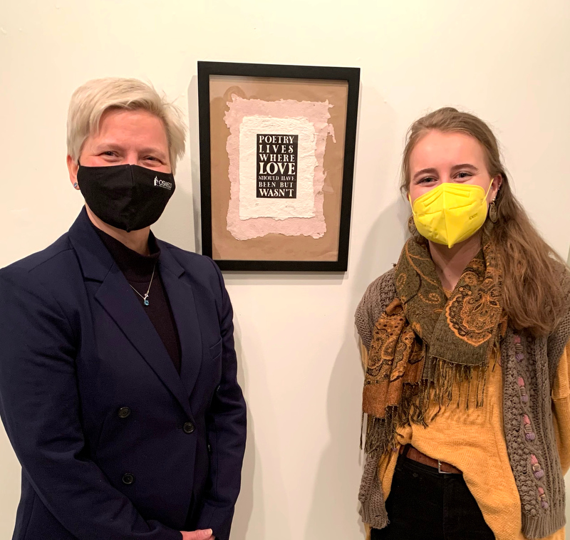 Madison Rosier, pictured at right with SUNY Oswego Officer in Charge Mary Toale, won a President's Purchase Award at this year's Juried Student Art Exhibition for her poem titled “Poetry Lives Where Love Should Have Been But Wasn't.”