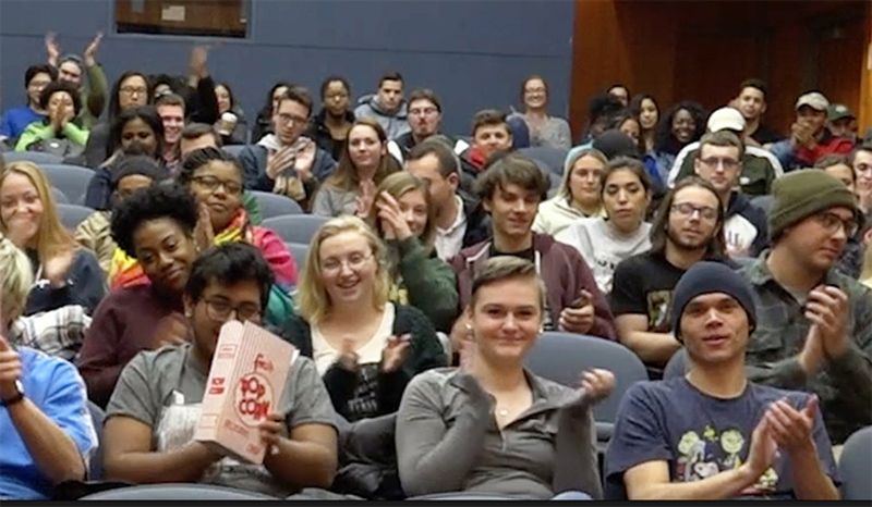 Audience of students applauding Maya Angelou documentary and its director Rita Coburn