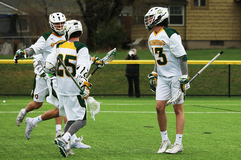 Men's lacrosse players celebrate