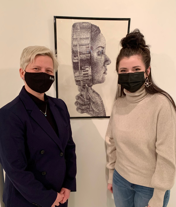 Natalie Archibee, pictured at right with SUNY Oswego Officer in Charge Mary Toale, won a President's Purchase Award at this year's Juried Student Art Exhibition for her drawing “The Looking Glass.”