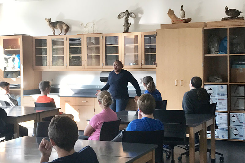 Cayla Turner speaks with about 90 Oswego Middle School students at Rice Creek Field Station