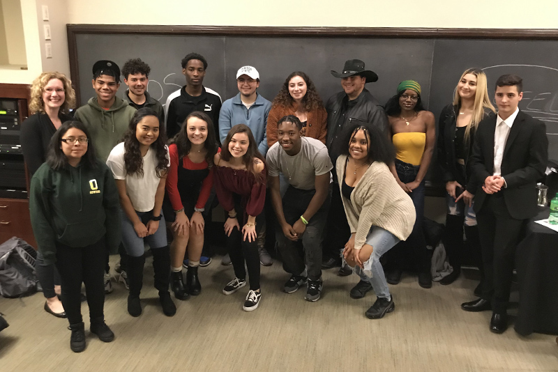 Students read their spoken-word poetry as part of a first-year class