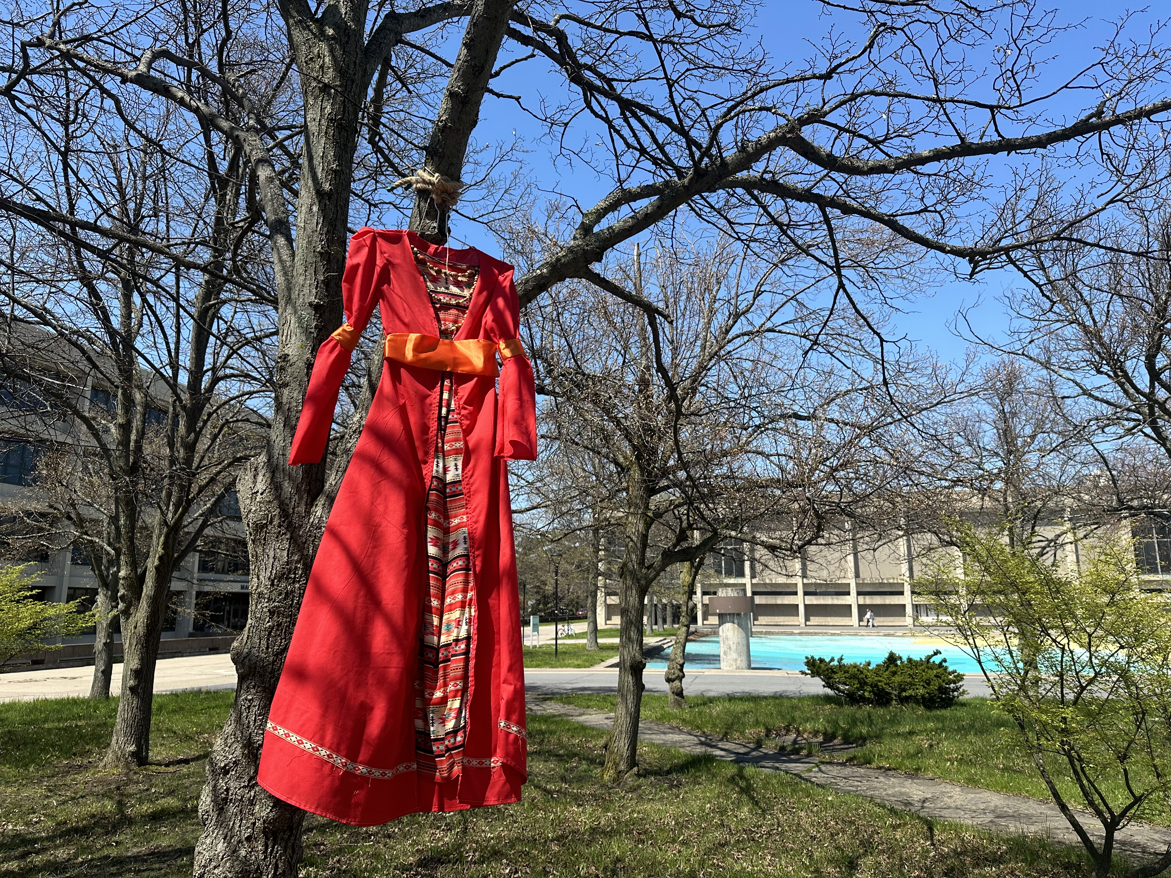 The Red Dress Art Installation Project returned to campus to raise awareness of Missing and Murdered Indigenous Women (#MMIW). Red dresses made by students are displayed on campus (on the sundial of the academic quad) from April 19 to May 3.