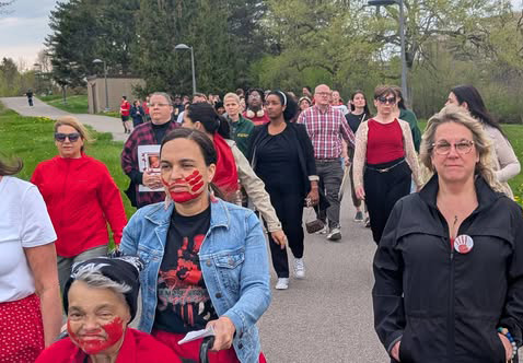 Members of the campus community took part in a Red Dress Day Remembrance on May 5, honoring missing and murdered indigenous women, girls and Two-Spirit people. The event, which also used a #MMIW hashtag, also was visible by the red dress art installation outside of Tyler Hall.