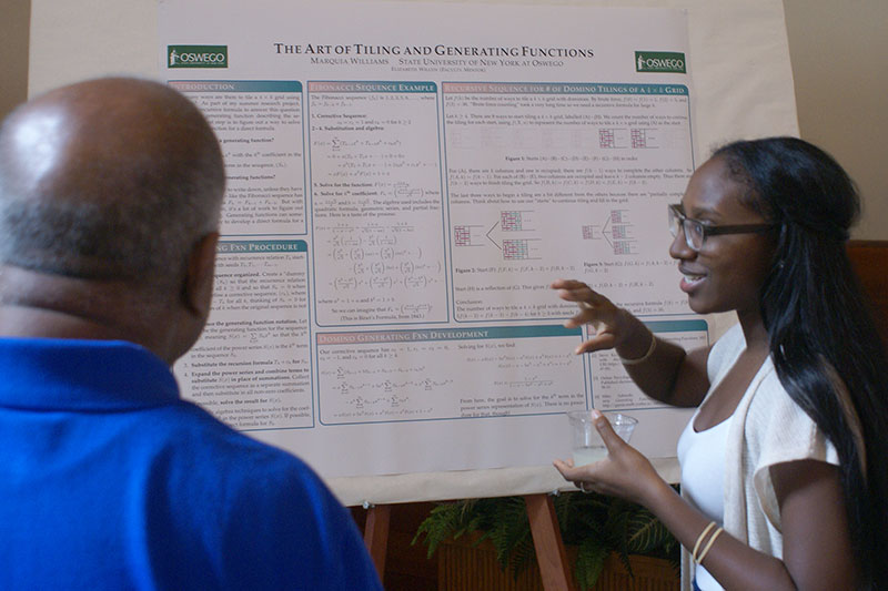 Mathematics major Marquia Williams presents her poster