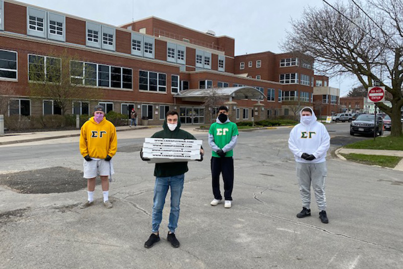 Members of the college’s Sigma Gamma fraternity donated pizza to Oswego Hospital to provide lunch for some local health-care heroes on April 17