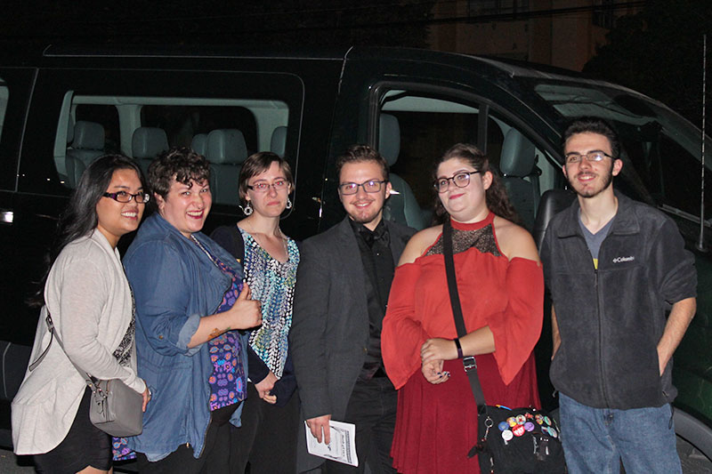 Group visiting Stanley Theatre gather to pose