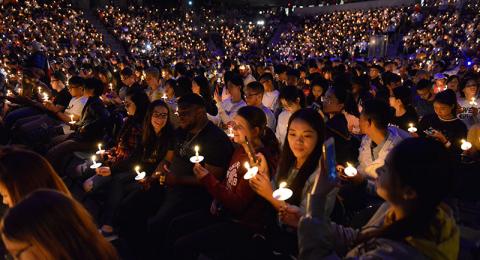 Students holding candles at Torchlight