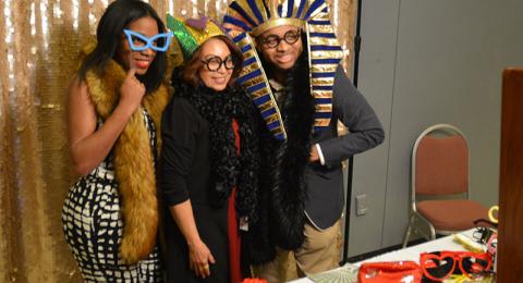 Visitors to Black Student Union 50th anniversary celebration dress up with props and costumes