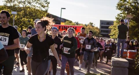 Students take part in Pumpkin Run/Walk fundraiser for Blessings in a Backpack