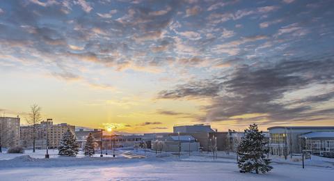 Sunset paints colors on snow-covered SUNY Oswego landscape