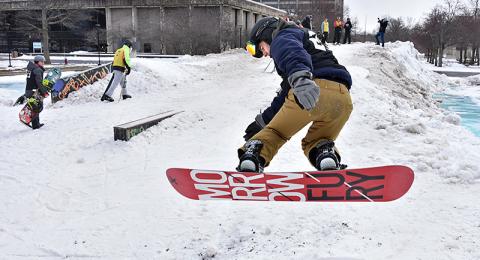 The annual Rail Jam, hosted by the Oswego Ski and Snowboard Club, had a fresh supply of lake-effect snow for its friendly competition on Feb. 28 on the academic quad. Here snowboarder Chris Hallock catches some air.