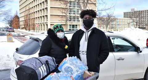 Freshman Trae Metzger moves into Oneida Hall on Jan. 24 with help from his mother.