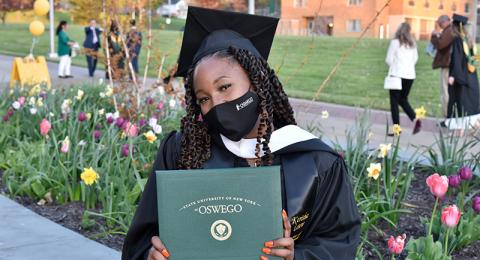 Kerisha Lewis earned her master's in strategic communication at the May 14 Commencement ceremony. Lewis earned her bachelor's from Oswego in 2018 and is now the college's assistant director of student-alumni engagement