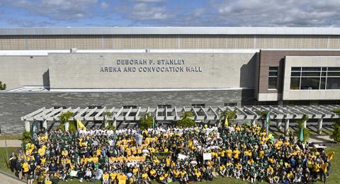 Lakers and guests adorned in Oswego colors took part in a very special 2021 Green and Gold Day photo on Friday, Oct. 1, in front of the newly named Deborah F. Stanley Arena and Convocation Hall.