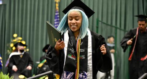 Shown during her class of 2021 graduation is Lorenne Huaman, who earned a bachelor's degree from the School of Communication, Media and the Arts, and served as Black Student Union vice president in 2020-21.