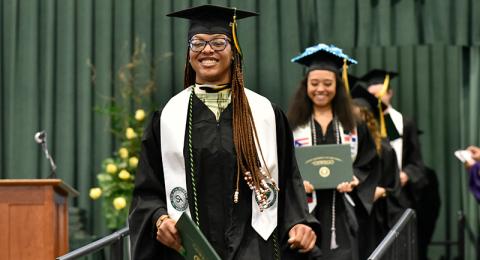 Student Association President Takayla Beckon walks down the graduation ramp during a May 14 Commencement ceremony