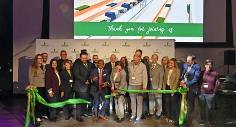 President Peter O. Nwosu and Jennifer Knapp, dean of the College of Communication, Media and the Arts, surrounded by members of the Laker family, partners and supporters, cut the ceremonial ribbon officially re-opening Hewitt Hall 