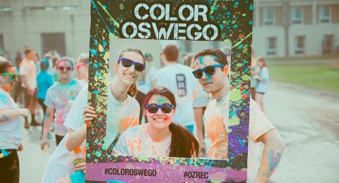 Students wearing colorful dye after Color Oswego Run