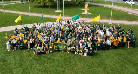 Students, alumni, faculty and staff showed their Oswego spirit by proudly showing Oswego's college colors in the official Green and Gold campus photo Sept. 30. The annual event is held in conjunction with Founder's Weekend.