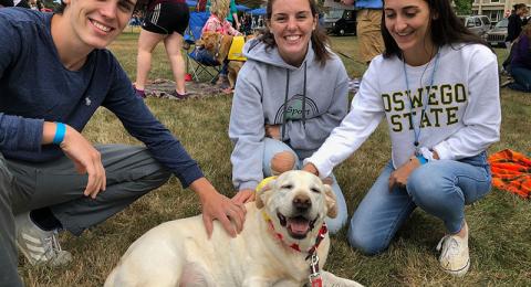 River the dog making students happy, because she's a good dog