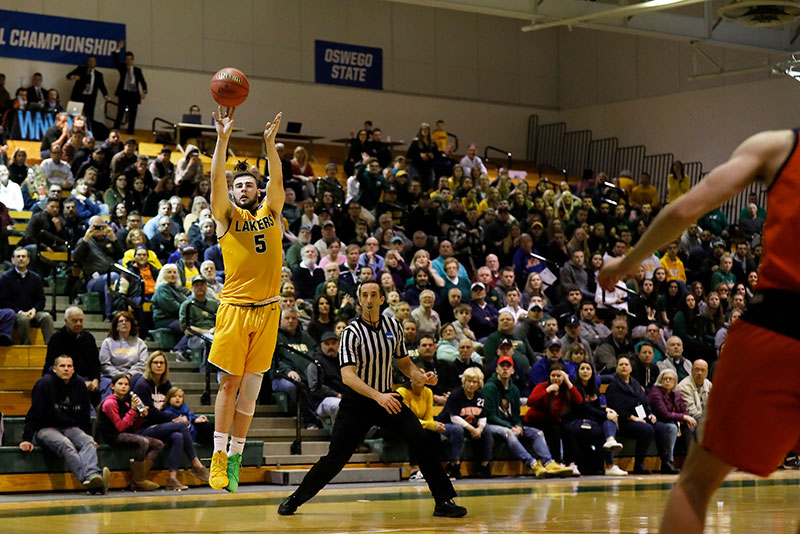 Joe Sullivan launches a three-point shot as the nationally ranked men's basketball team wins