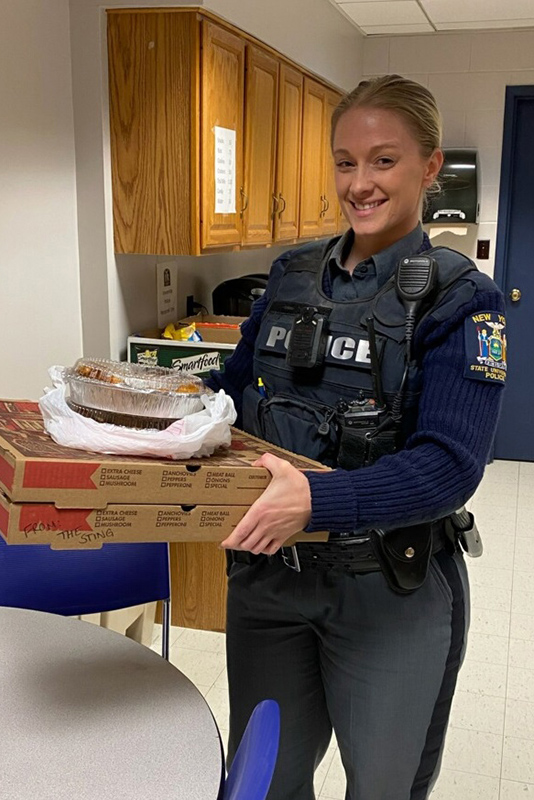 Officer Amanda Drummond holds lunch donated by The Sting in early April