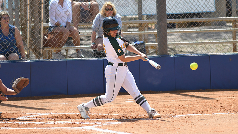 Rebecca Vilchez hitting a softball