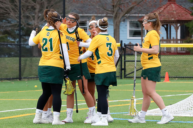 Women's lacrosse players celebrate