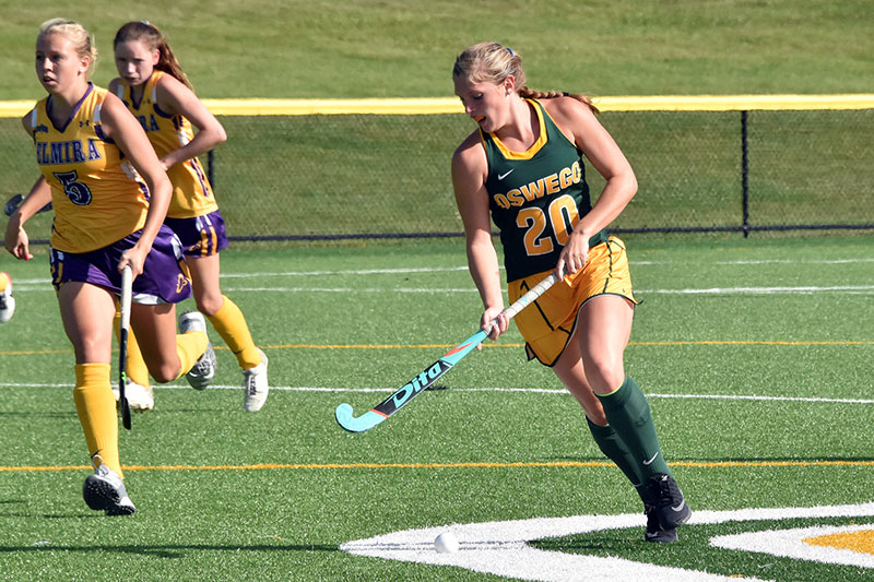 Action photo of Lacey Woite playing field hockey