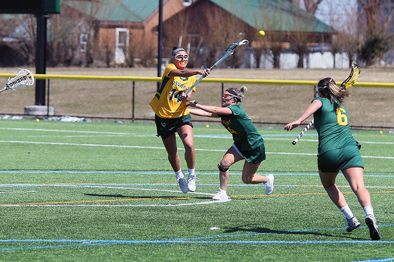 Laker women's lacorsse player Brigid Regin makes a pass